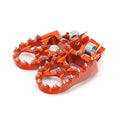 CNC billet 7075 aluminum footpegs motocross dirt bike KTM Honda CRF Yamaha YZ wide platform anodized orange black replaceable teeth