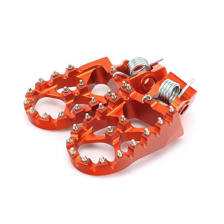 CNC billet 7075 aluminum footpegs motocross dirt bike KTM Honda CRF Yamaha YZ wide platform anodized orange black replaceable teeth